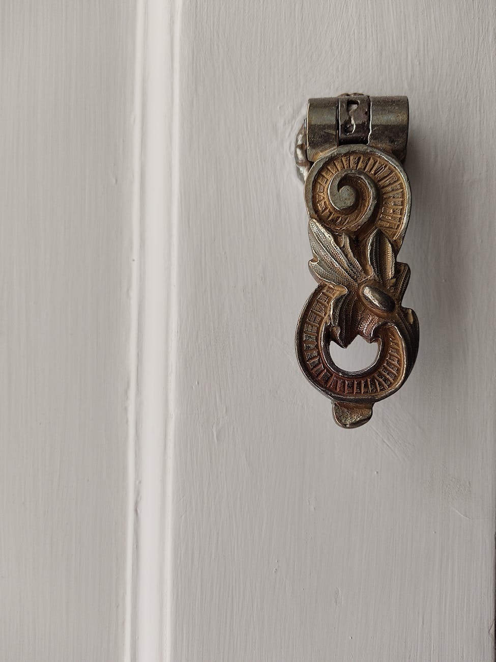 Hand-carved brass door handle and traditional hardware detail